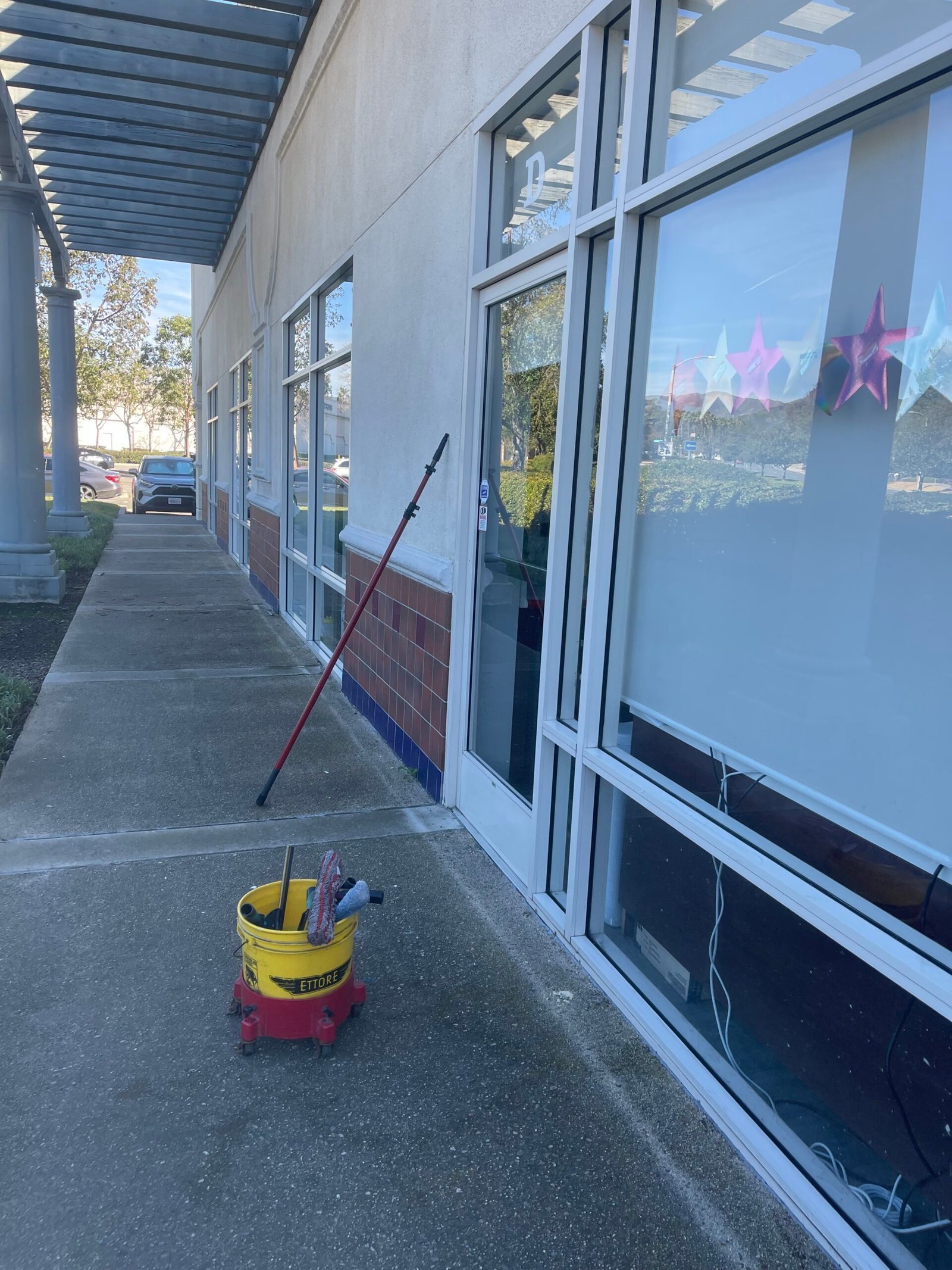 Storefront glass and Evans Dynamic window-cleaning equipment