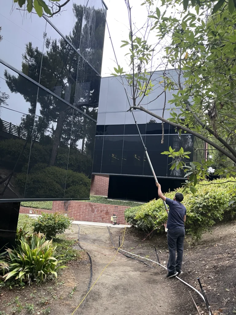 Water-fed pole window cleaning at an Evans Dynamic commercial job